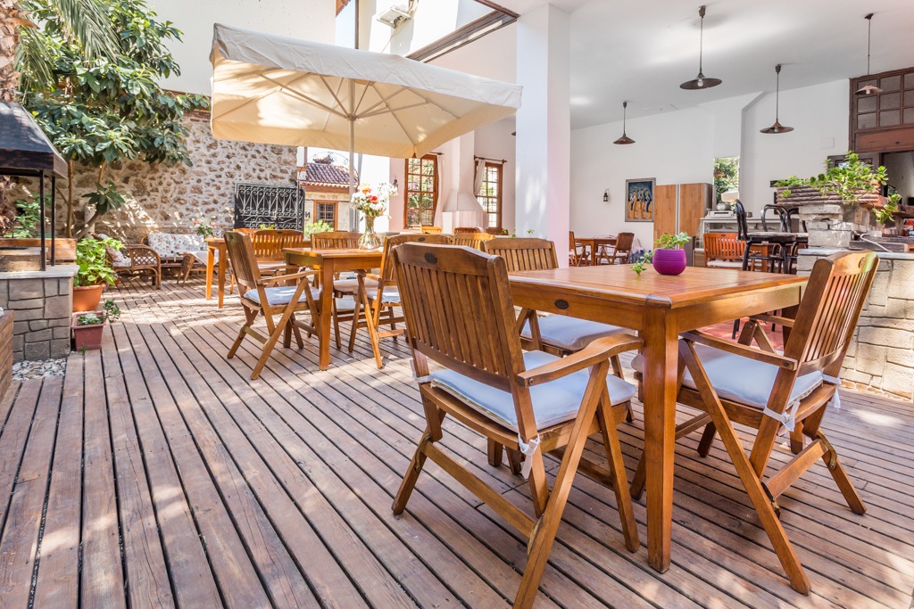 Covered terrace with work tables at GYC House.